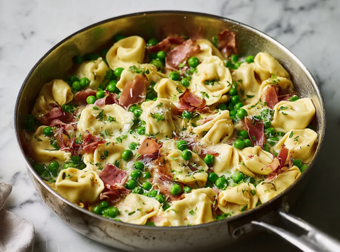 Romige Tortellini met Prosciutto en Doperwten